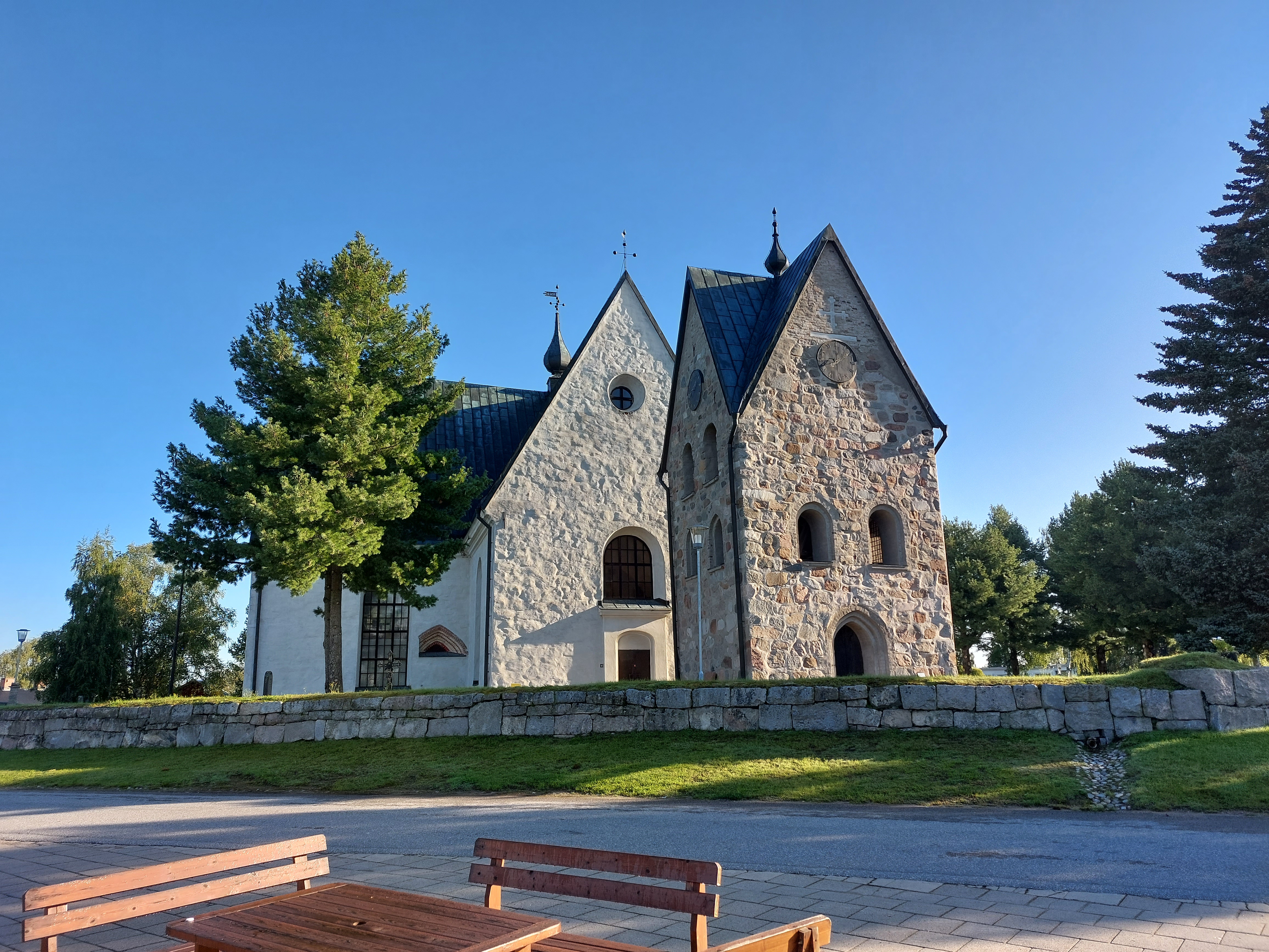 Öjeby church with the bell tower in front.